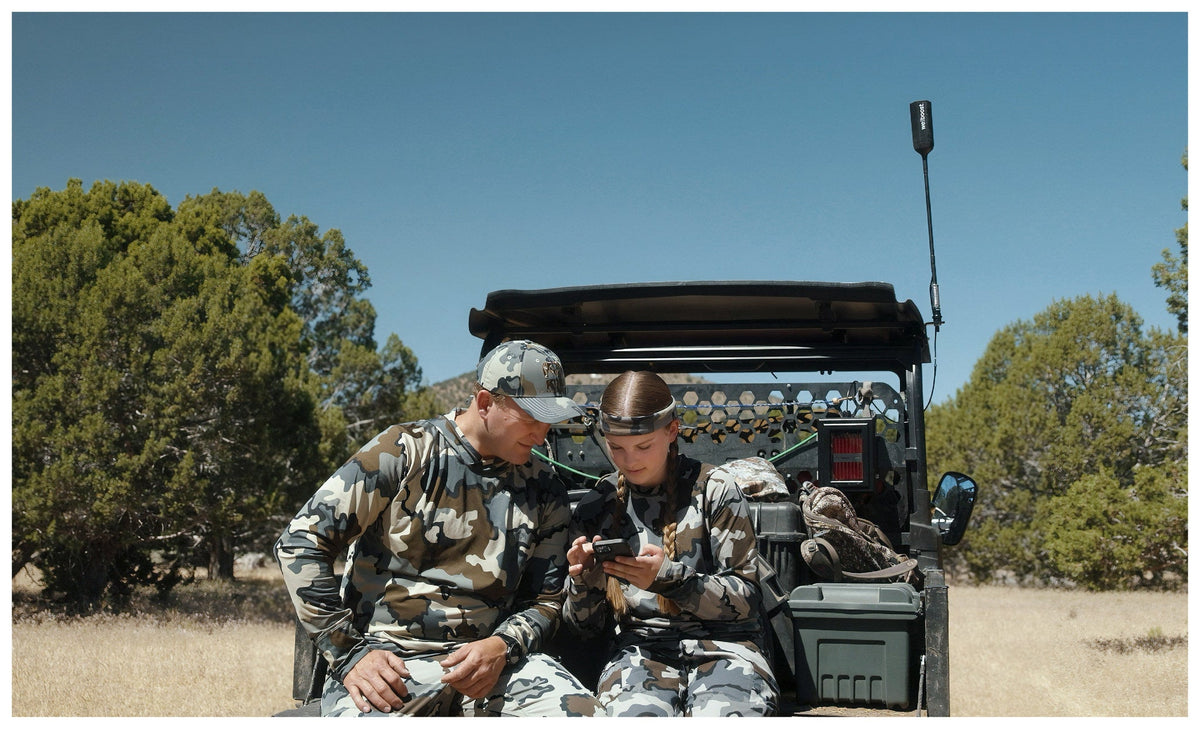 Father and daughter hunting with a side by side fitted with the weBoost SxS