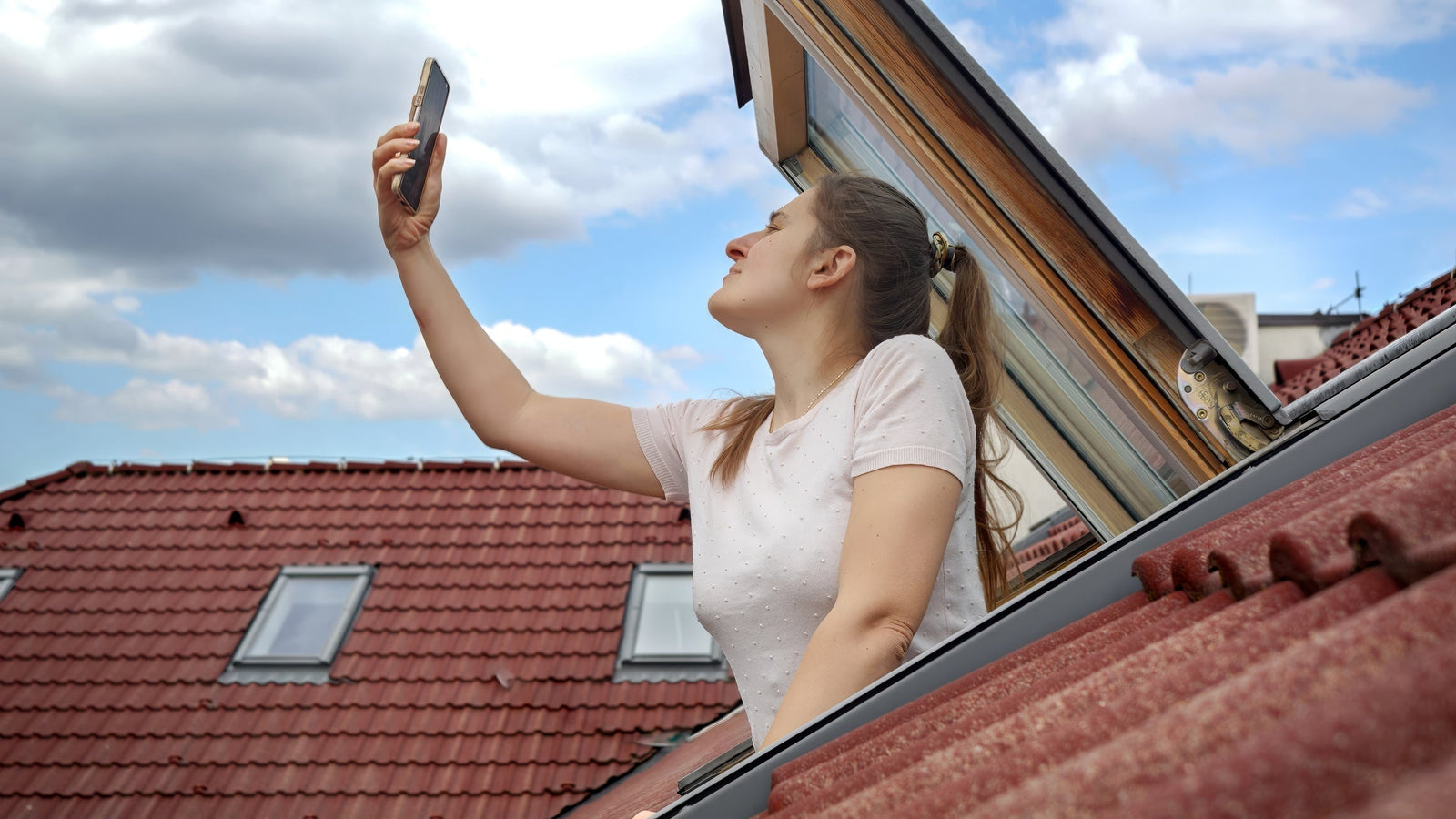 Person holding a phone up to check cell signal strength