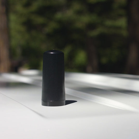 weBoost Drive Reach Fleet NMO antenna installed on a fleet van roof
